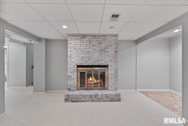 5315 34th Ave, Moline, IL 61265 - unfurnished living room featuring a brick fireplace, carpet flooring, a drop ceiling, and recessed lighting