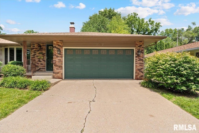 5315 34th Ave, Moline, IL 61265 - ranch-style house with brick siding, concrete driveway, a garage, and a chimney