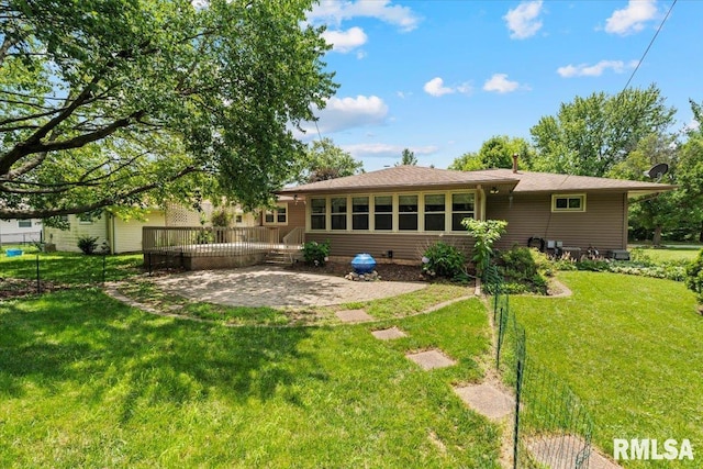 5315 34th Ave, Moline, IL 61265 - back of property featuring a deck, a patio area, and a yard