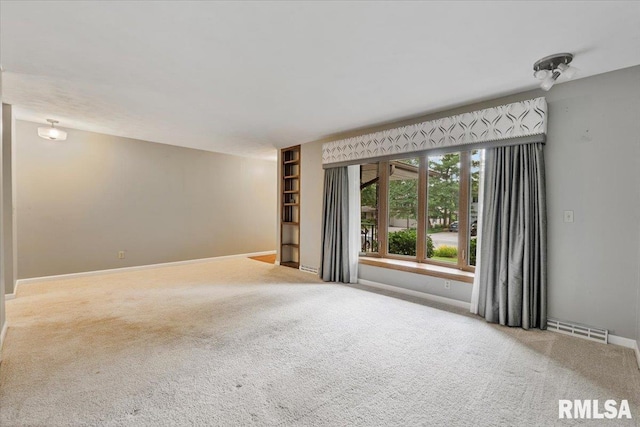 5315 34th Ave, Moline, IL 61265 - carpeted spare room with baseboards