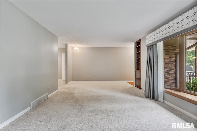 5315 34th Ave, Moline, IL 61265 - carpeted empty room featuring baseboards
