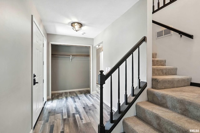 4345 Amesbury Dr, Bettendorf, IA 52722 - entryway with wood finished floors and stairs