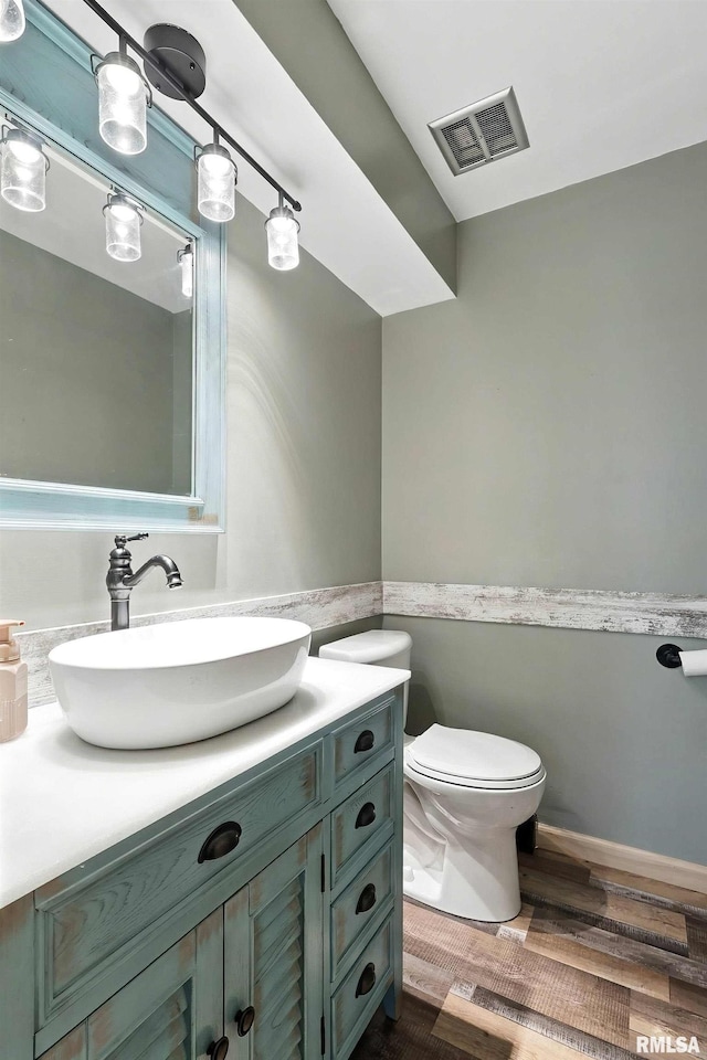 4345 Amesbury Dr, Bettendorf, IA 52722 - half bath with vanity and wood finished floors