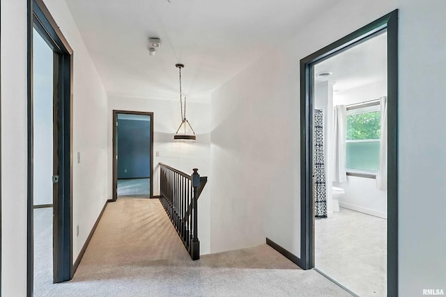 4345 Amesbury Dr, Bettendorf, IA 52722 - hall with an upstairs landing and carpet