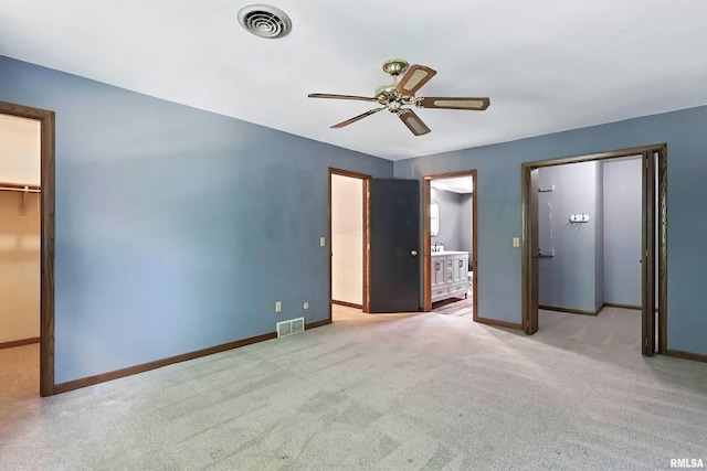 4345 Amesbury Dr, Bettendorf, IA 52722 - unfurnished bedroom with a spacious closet, carpet, a closet, and connected bathroom