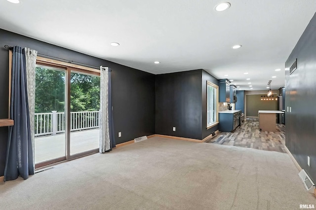 4345 Amesbury Dr, Bettendorf, IA 52722 - empty room featuring light colored carpet and recessed lighting