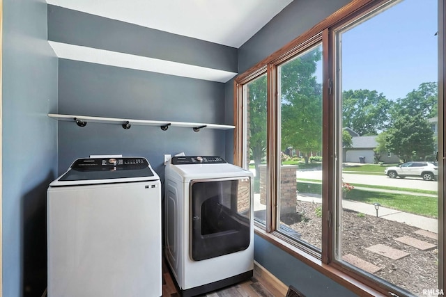 4345 Amesbury Dr, Bettendorf, IA 52722 - washroom with washer and clothes dryer and wood finished floors