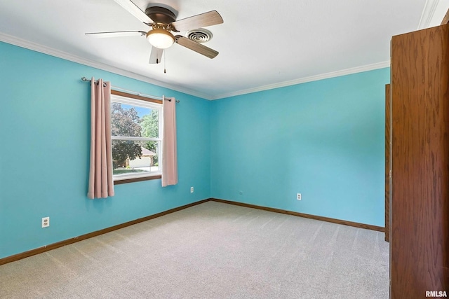 4345 Amesbury Dr, Bettendorf, IA 52722 - carpeted spare room featuring ornamental molding and a ceiling fan