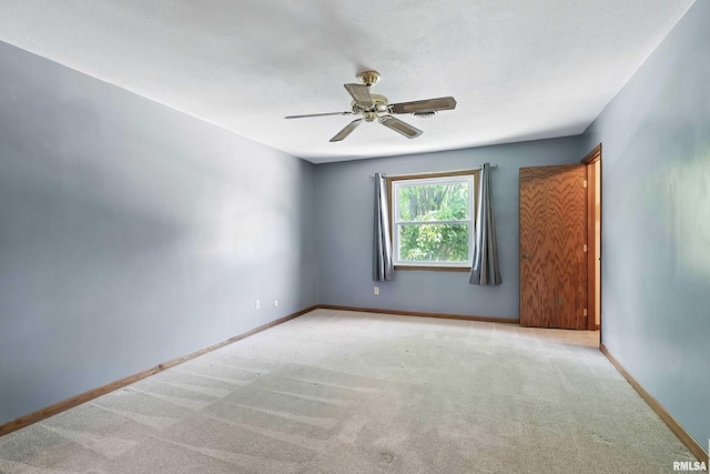 4345 Amesbury Dr, Bettendorf, IA 52722 - spare room featuring a ceiling fan and carpet floors