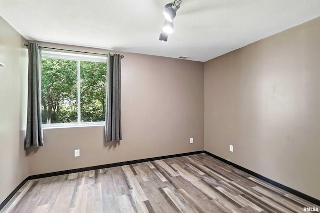 4345 Amesbury Dr, Bettendorf, IA 52722 - unfurnished room with wood finished floors and baseboards