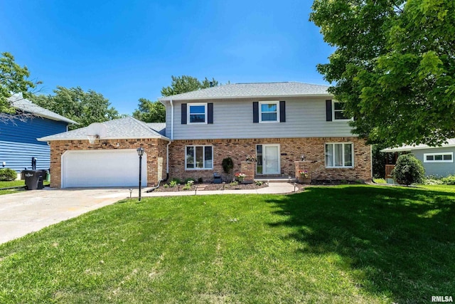 4345 Amesbury Dr, Bettendorf, IA 52722 - view of front of home featuring an attached garage, a front yard, concrete driveway, and brick siding