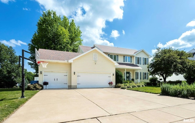 1200 Bridgeview Place, Le Claire, IA 52753 - view of front of property with an attached garage, concrete driveway, a front yard, and a shingled roof