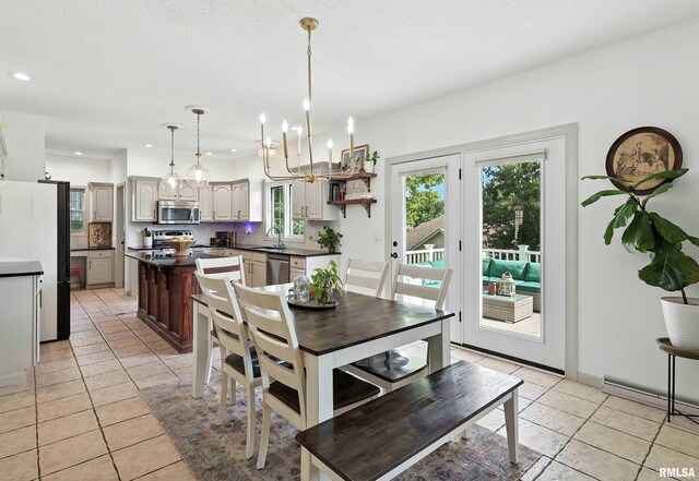 1200 Bridgeview Place, Le Claire, IA 52753 - dining area featuring light tile patterned floors, recessed lighting, and a chandelier
