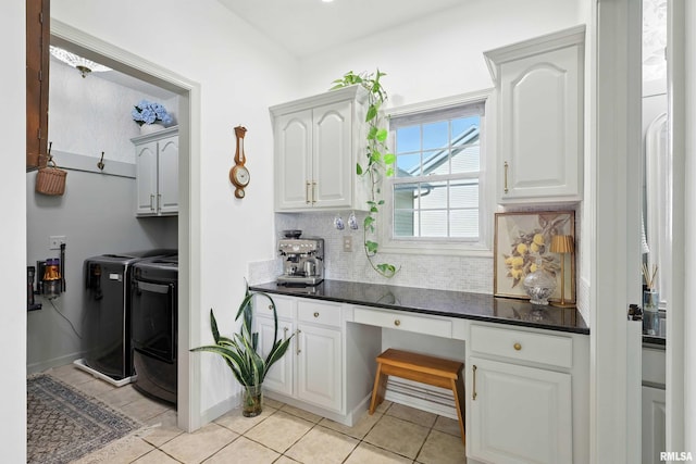1200 Bridgeview Place, Le Claire, IA 52753 - laundry room featuring washer and dryer, cabinet space, a desk, and light tile patterned floors