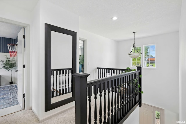 1200 Bridgeview Place, Le Claire, IA 52753 - hall featuring an upstairs landing, carpet floors, and recessed lighting