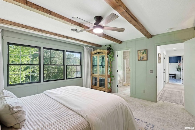 1200 Bridgeview Place, Le Claire, IA 52753 - bedroom featuring beamed ceiling, light colored carpet, connected bathroom, and ceiling fan