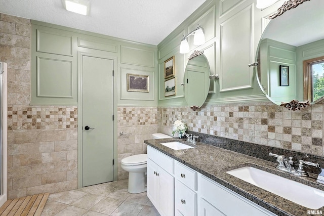 1200 Bridgeview Place, Le Claire, IA 52753 - full bathroom with tile walls, tile patterned floors, and double vanity