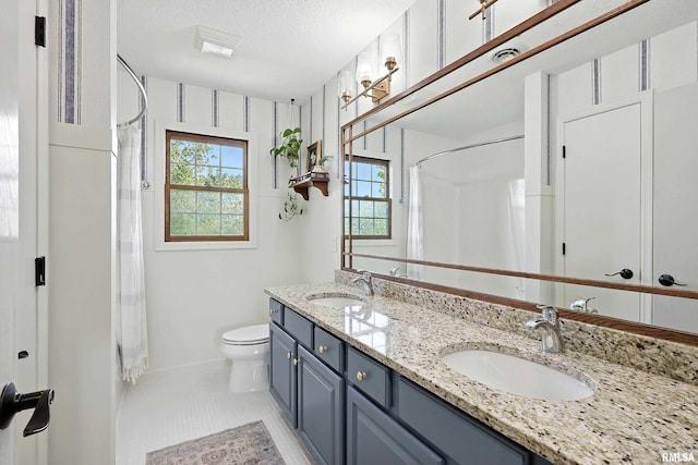 1200 Bridgeview Place, Le Claire, IA 52753 - full bathroom with a shower with shower curtain, double vanity, a textured ceiling, and tile patterned flooring
