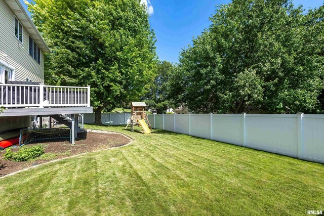 1200 Bridgeview Place, Le Claire, IA 52753 - fenced backyard with stairway, a wooden deck, and a playground