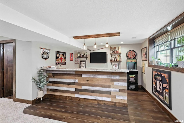 1200 Bridgeview Place, Le Claire, IA 52753 - indoor wet bar featuring wood finish floors, a textured ceiling, and pendant lighting