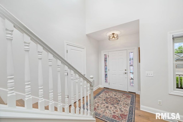 1100 Wild W Dr, Le Claire, IA 52753 - entryway with wood finished floors and stairway