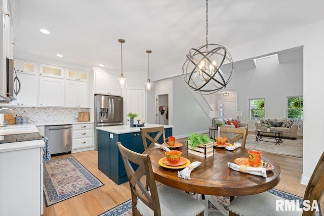 1100 Wild W Dr, Le Claire, IA 52753 - dining area featuring light wood finished floors, a chandelier, and recessed lighting