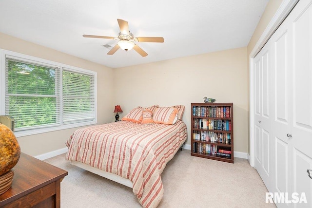 1100 Wild W Dr, Le Claire, IA 52753 - carpeted bedroom featuring a closet and ceiling fan