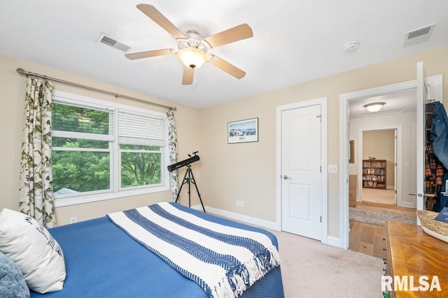1100 Wild W Dr, Le Claire, IA 52753 - bedroom featuring carpet and a ceiling fan