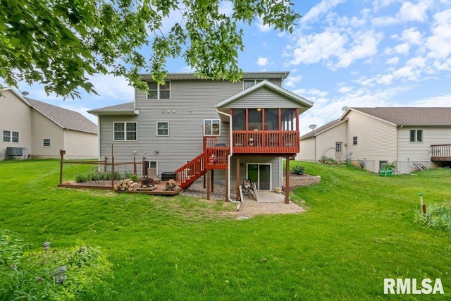1100 Wild W Dr, Le Claire, IA 52753 - back of property featuring a sunroom, a deck, a lawn, and a patio area