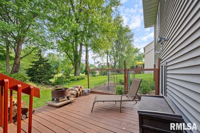 1100 Wild W Dr, Le Claire, IA 52753 - wooden deck with an outdoor fire pit