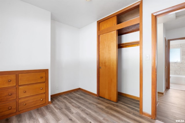 612 Waverly Rd, Davenport, IA 52804 - unfurnished bedroom with light wood finished floors and a closet
