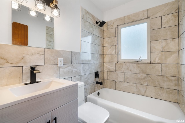 612 Waverly Rd, Davenport, IA 52804 - full bathroom featuring tile walls, vanity, and shower / tub combination