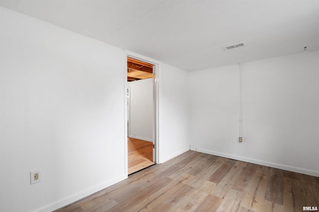612 Waverly Rd, Davenport, IA 52804 - unfurnished room featuring wood finished floors and baseboards