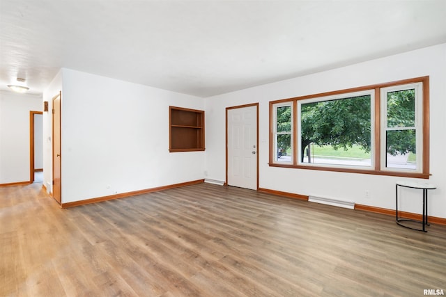 612 Waverly Rd, Davenport, IA 52804 - empty room with light wood-type flooring and baseboards