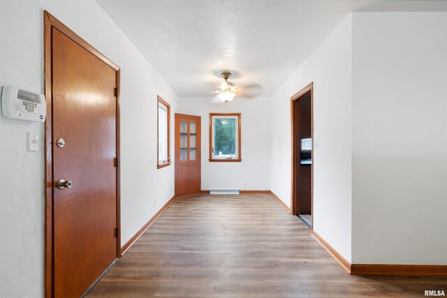 612 Waverly Rd, Davenport, IA 52804 - corridor featuring wood finished floors and baseboards