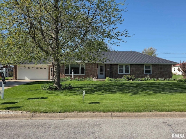 206 E 13th St, Tipton, IA 52772 - ranch-style home featuring brick siding, a front yard, an attached garage, and driveway