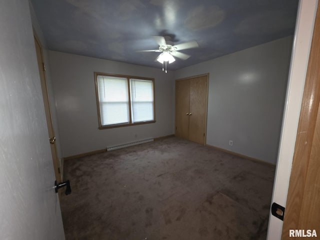 206 E 13th St, Tipton, IA 52772 - unfurnished bedroom with a baseboard radiator, light colored carpet, and a ceiling fan