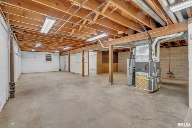 206 E 13th St, Tipton, IA 52772 - unfinished below grade area with water heater and heating unit
