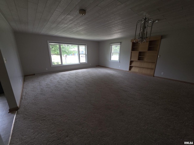 206 E 13th St, Tipton, IA 52772 - carpeted spare room with a chandelier, a smoke detector, and wooden ceiling