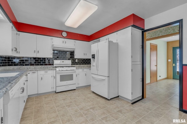 206 E 13th St, Tipton, IA 52772 - kitchen featuring white appliances, under cabinet range hood, decorative backsplash, and white cabinets