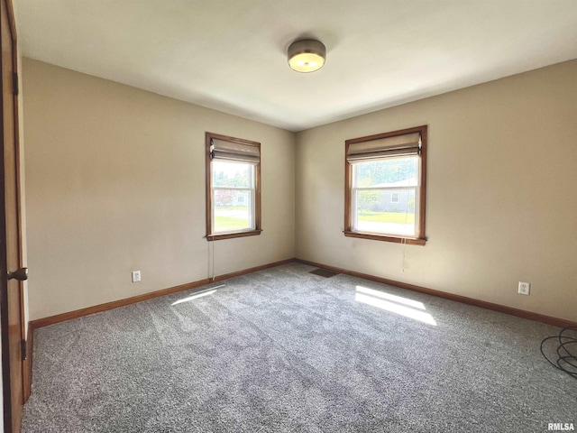 1130 53rd St, Moline, IL 61265 - spare room with carpet floors and baseboards