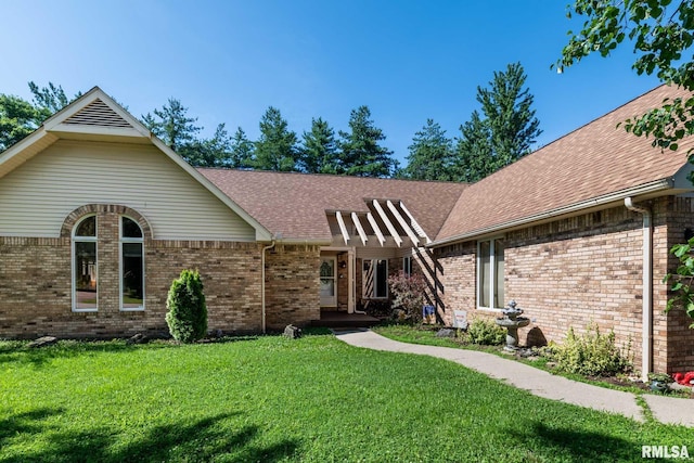 901 E Gregory Ave, Marion, IL 62959 - view of front facade featuring a front yard, brick siding, and a shingled roof