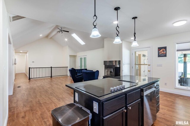 901 E Gregory Ave, Marion, IL 62959 - kitchen featuring black electric stovetop, light wood-style floors, ceiling fan, stainless steel dishwasher, and pendant lighting