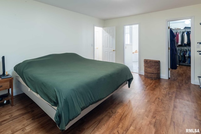 901 E Gregory Ave, Marion, IL 62959 - bedroom featuring wood finished floors and a walk in closet