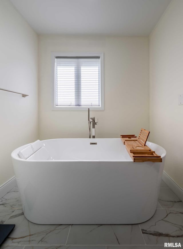 901 E Gregory Ave, Marion, IL 62959 - full bathroom featuring marble look tile flooring and a freestanding tub