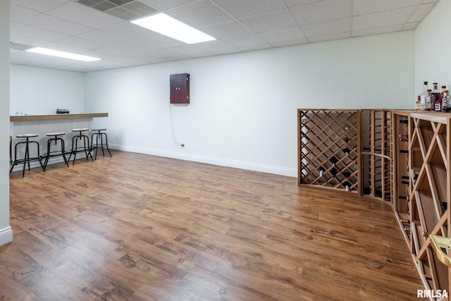 901 E Gregory Ave, Marion, IL 62959 - unfurnished room featuring a dry bar, wood finished floors, and a paneled ceiling