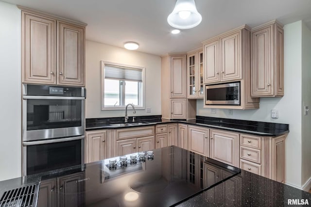 901 E Gregory Ave, Marion, IL 62959 - kitchen with appliances with stainless steel finishes, cream cabinets, glass insert cabinets, and dark stone counters