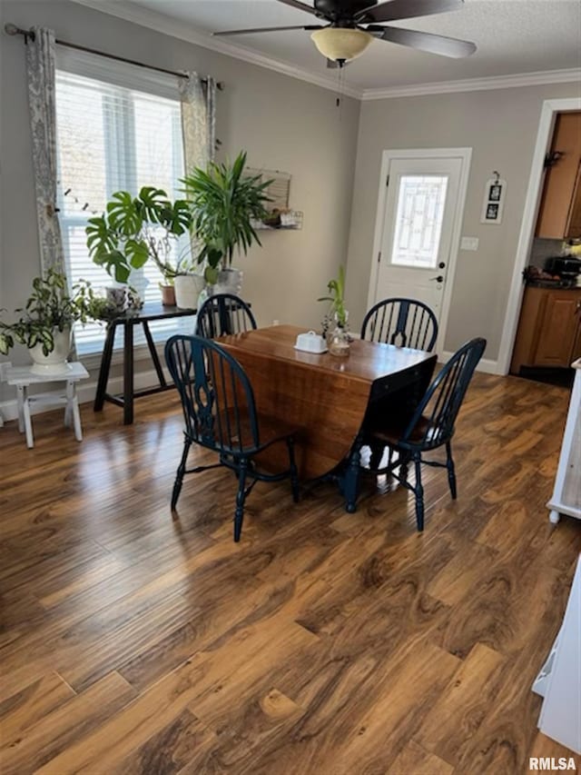3119 15th St Unit C, Moline, IL 61265 - dining area featuring a ceiling fan, crown molding, and dark wood-style floors