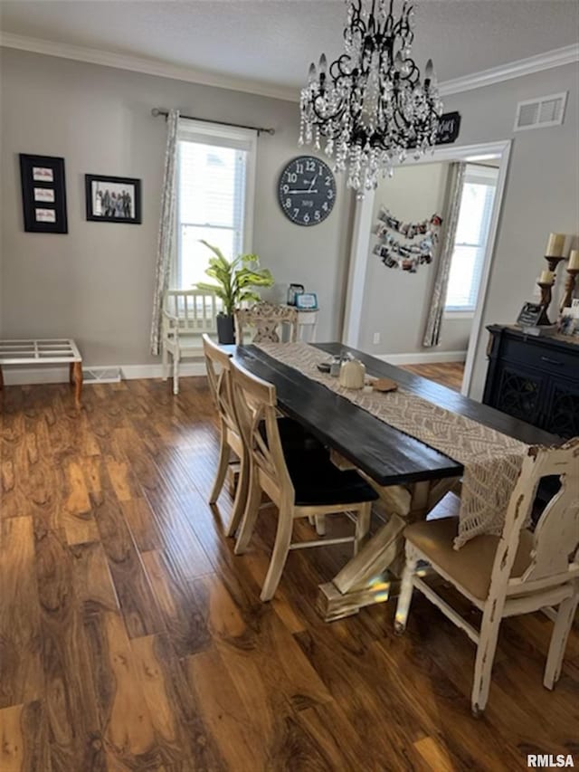 3119 15th St Unit C, Moline, IL 61265 - dining area featuring ornamental molding, wood finished floors, healthy amount of natural light, a chandelier, and a textured ceiling