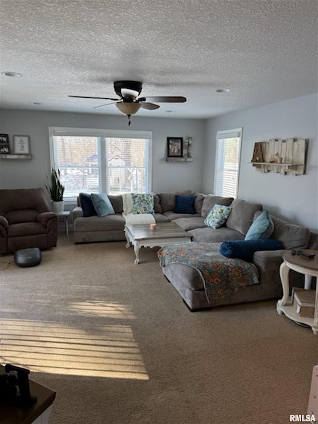 3119 15th St Unit C, Moline, IL 61265 - carpeted living area with a ceiling fan and a textured ceiling